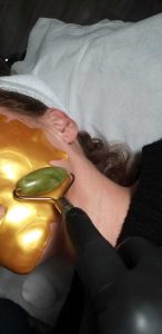 using a roller to massage face