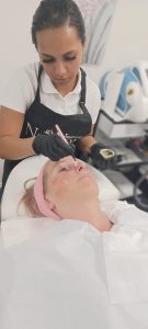 client getting facial done